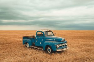 old truck parked in field - patrick's mobile