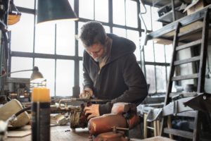 Man repairing rusty engine